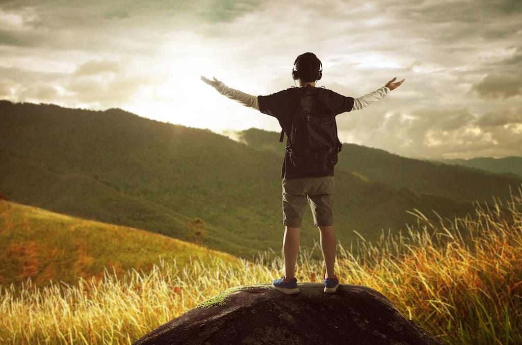 2 Hiker With Backpack Standing On Top Of A Mountain With Raised Hands And Enjoying Sunri SBI 301984968