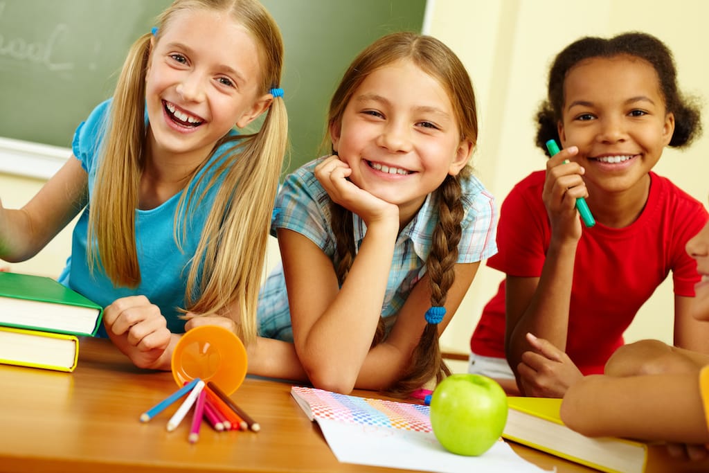 4 Portrait Of Joyful Schoolgirls Laughing In Classroom SBI 300730802